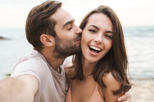 Image,Of,Young,Happy,Man,Kissing,And,Hugging,Beautiful,Woman